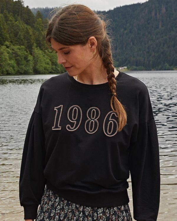 Sweat uni à broderie 1986 à col rond manches ballons noir Sweat uni à broderie 1986 à col rond manches ballons noir