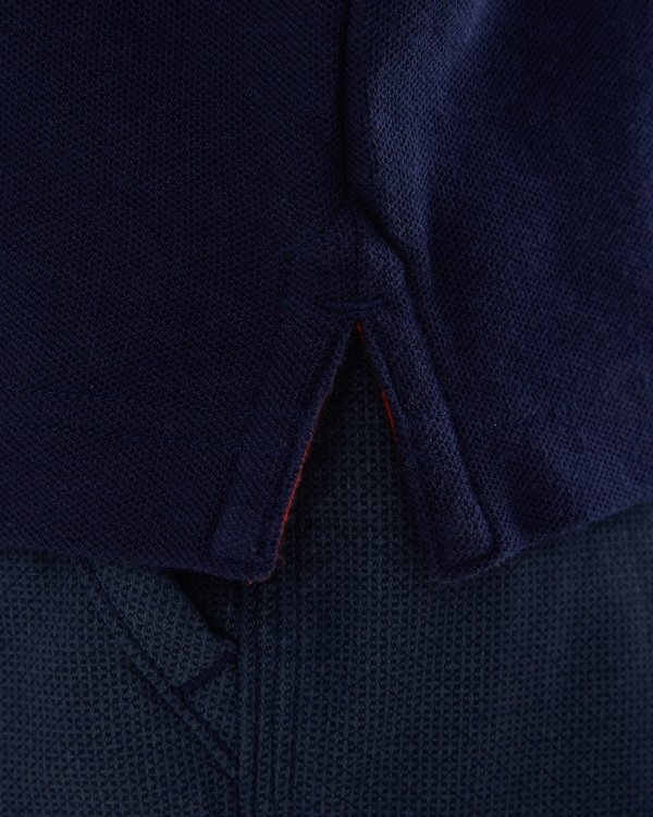 Polo manches courtes détails tricolores en coton bleu