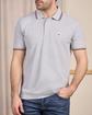 Polo logo badge gris
